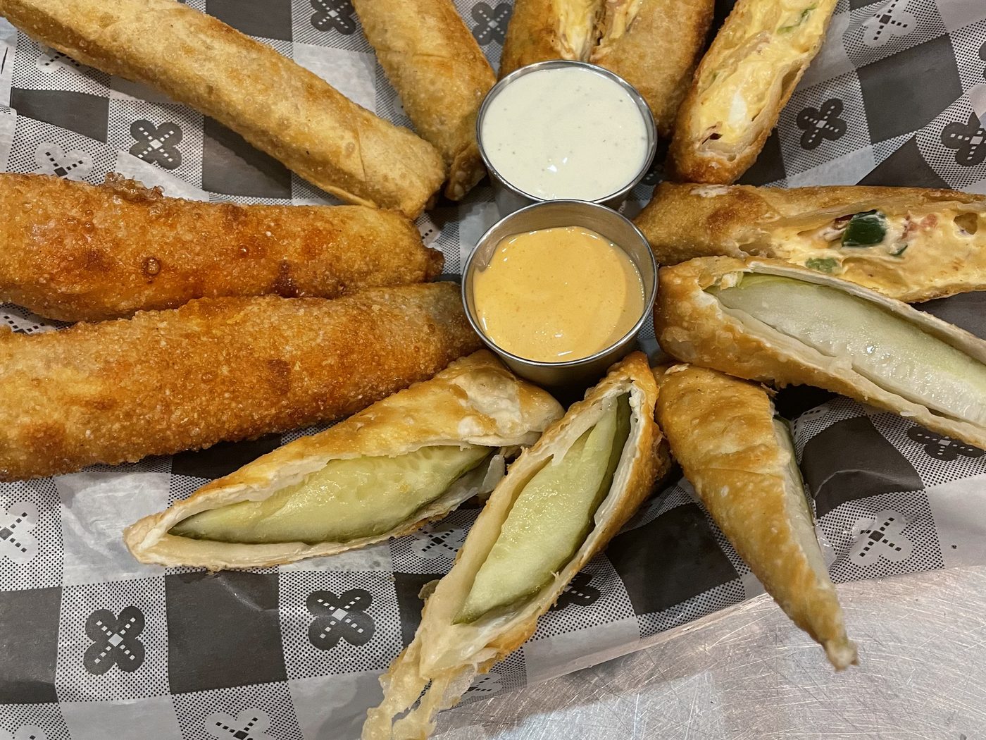 The appetizer sampler: poppers, egg rolls and cheese sticks with ranch and cheese sauce